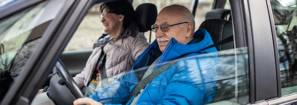 Senior couple driving