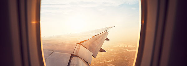 View from the window of the airplane at the sunrise