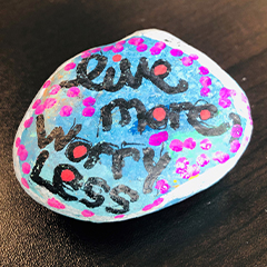 Rock painted with Live More Worry Less