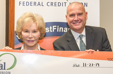 Dr. Grasmick with the check from First Financial Federal Credit Union
