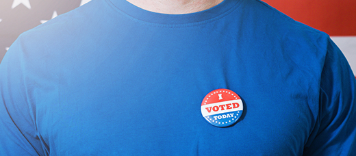 Man wearing an I Voted button