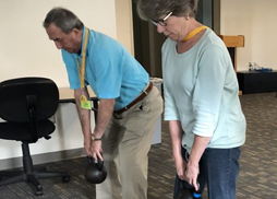 Osher members lifting weights