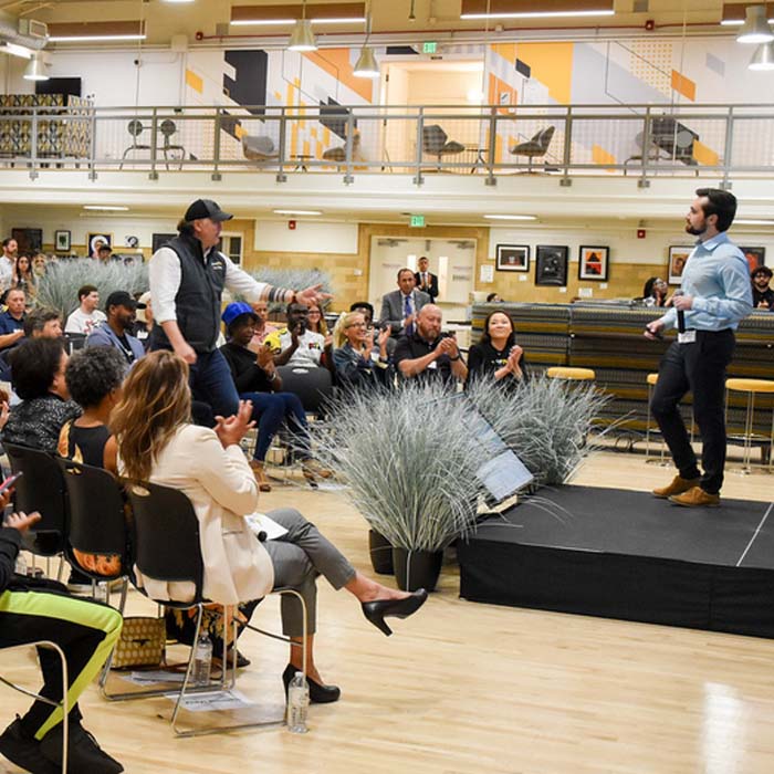 Students presenting at the armory